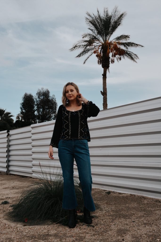 Girl in front of a wall in Palm Springs, California