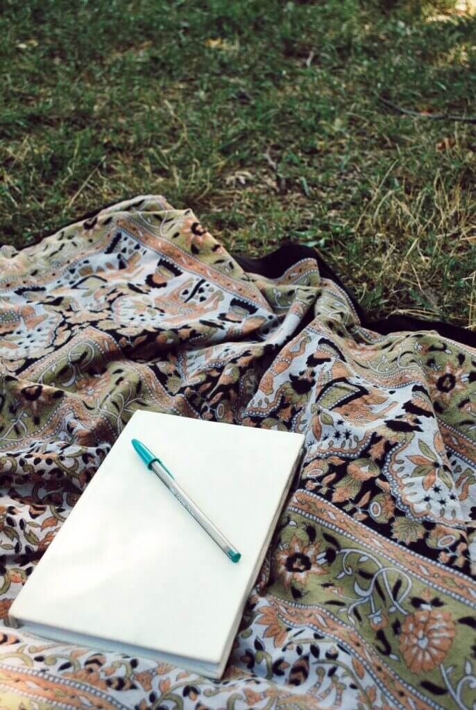 Journal on a tapestry waiting for someone to start writing