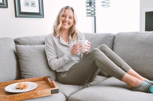 Woman sitting on the couch in comfy loungewear