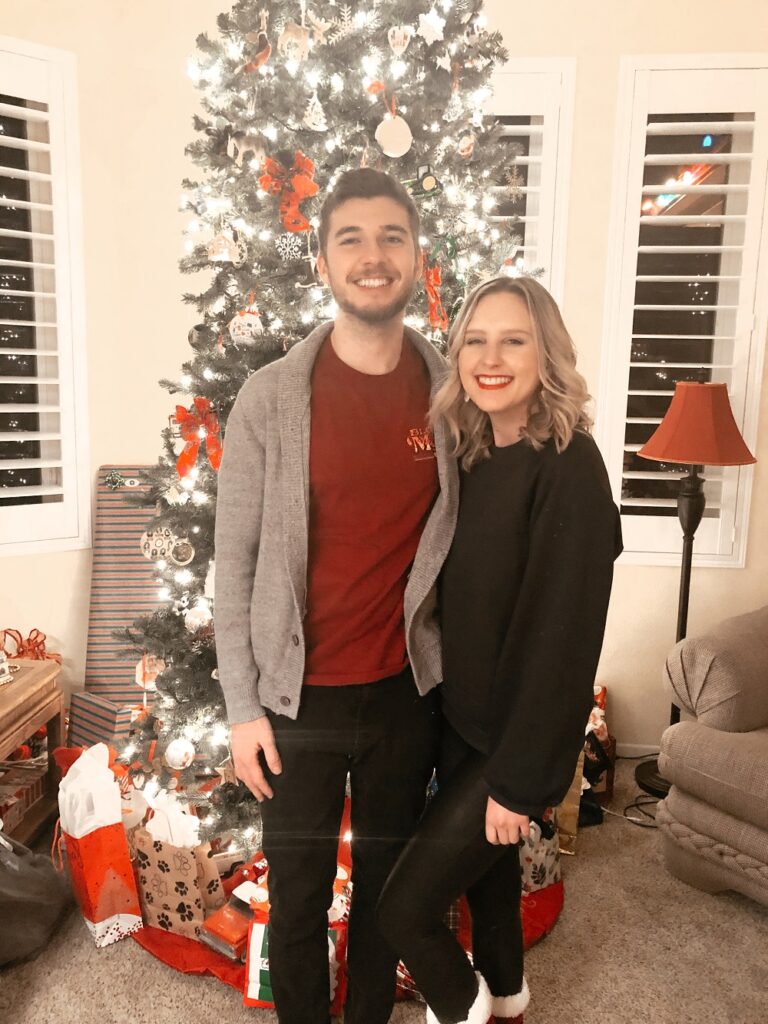 Couple in front of a Christmas tree in 2020